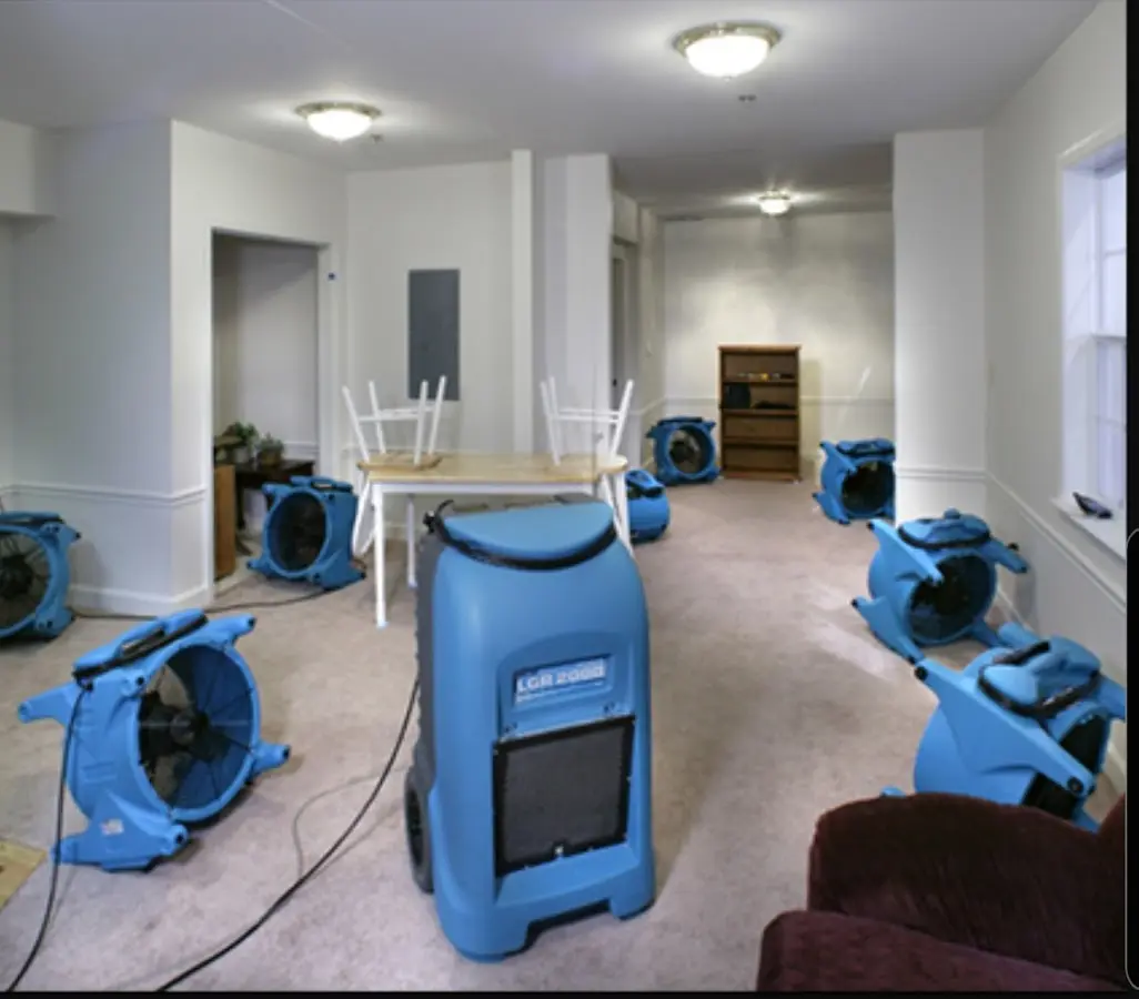 Air movers and dehumidifier setup for Water Damage Restoration in Warrington